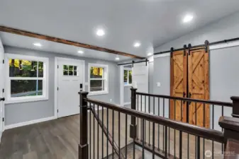 Front entrance steps into a pleasant surprise of modern comfort with a peaceful natural charm.