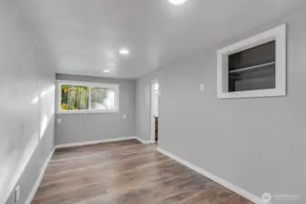 Lower-level bonus room, excellent space for fitness, playroom or craft space.