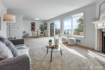 Living Room Opens to Dining Room and Private Deck offering breathtaking Lake and City Skyline views.