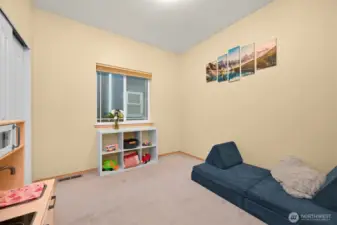 Bedroom 1, Start of hallway near laundry & garage access