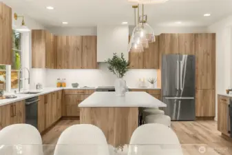 Bellmont cabinetry, Calacatta quartz, and Bosch appliances with a 36” induction range.