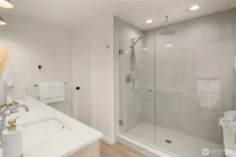 Spa-inspired primary bath with heated floors and thoughtfully selected tile.