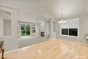 Bright and airy living room flows seamlessly into the dining space