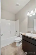 Second full bathroom conveniently located for guests.