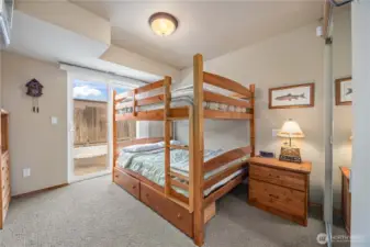 Additional guest bedroom with bunkbeds and full bath with laundry