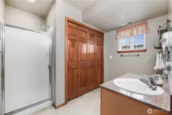 Hidden laundry in the guest bath