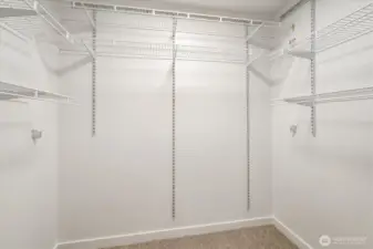 Primary bedroom walk in closet.
