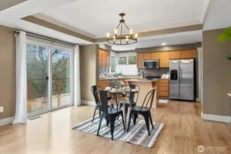 Dining room with sliding door leading out to backyard.