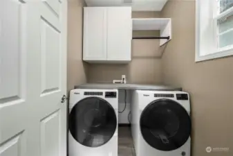 Laundry room with more storage.