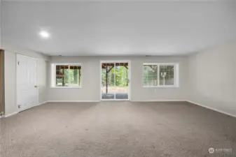 Huge bonus room downstairs that opens out to the backyard.  There's a 5th bedroom down here and also a rubber-floored exercise room.