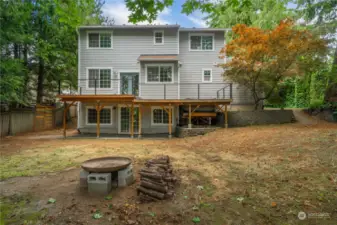 Looking back at the house with the RV parking space shown to the right, and also seeing how large the Trex deck is.  Hot tub on the right side of the deck as shown here.