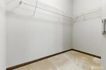 Primary bedroom walk-in closet
