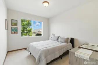 Currently used as a third bedroom, this space could be an office, playroom, sewing or craft room, or...