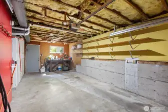 Deep single car garage with EV charging and a ton of storage built in.
