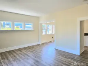 Living room to kitchen and dining, lots of windows & natural light.