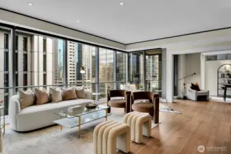 Living room in Unit 1205 flows into den/office