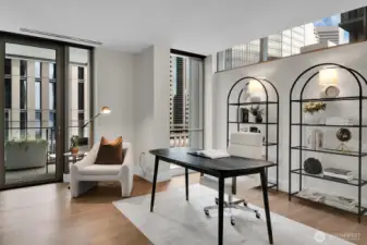 A covered deck is accessed from the den/office in Unit 1205