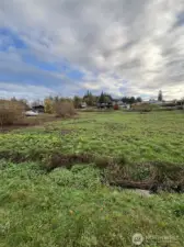 The lot is cleared and is .28 acres.  Acme Septic Design has determined the soils/lot can sustain a 3 bedroom home septic.