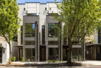 A striking display of modern architecture in the heart of one of Seattle’s most cherished neighborhoods. This bold corner residence showcases clean lines, oversized windows, and lush landscaping—perfectly positioned to offer quiet elegance just steps from the buzz of Madrona’s retail core.