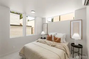 Light-filled bedroom with calming finishes and a modern aesthetic.