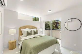 Primary suite with lush views and ample room to unwind.