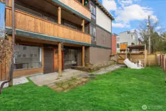 Grass is Virtual  Back yard patio for unit 102