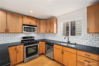 Cooks kitchen with gas range.