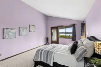 There’s a sense of separation here that really works. With a split bedroom layout, the primary suite stands on its own, giving you that added layer of privacy that’s hard to come by. Just outside the door, a covered patio creates an easy extension of the room, offering a sheltered place to sit and enjoy the water view regardless of the forecast. It adds a little daily luxury without feeling over the top. The combination of privacy, outdoor access, and that view makes this space feel especially comfortable and well thought out.