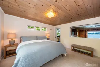Main level spacious bedroom with views of the water.