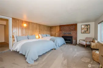 Lower level primary with gas fireplace.