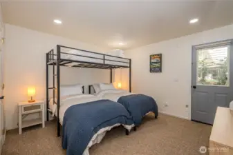 Lower level bedroom with 3 twin beds.