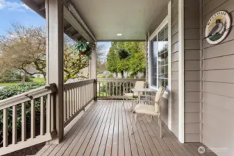 Covered front porch to enjoy your beautiful yard from.