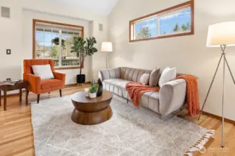 Formal living room has high ceilings and is light and bright.
