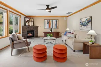 Spacious family room featuring crown moulding and a gas fireplace