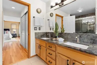 Hickory Hardwood cabinetry and new countertops in the primary bathroom.