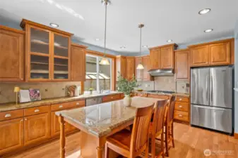 Kitchen has an abundance of cabinets for all of your storage needs.  There is a walk-through prep kitchen and pantry just to the right of the refrigerator with additional counter space and storage.