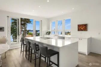 Home features a heated eating bar for four in this state-of-the-art kitchen.