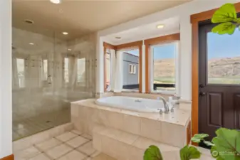 View 6 of upper level Primary dedroom 1 w/ bathroom suite w/ marble tile, oversized shower and soaking tub w/ view balcony.