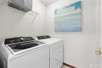 Conveniently positioned upper level laundry room. Washer and dryer stay. Dryer hook up is electric.