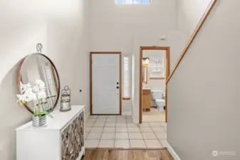 Open clear story foyer with tile floors.