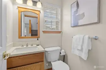 Half bath on the main for your guests. Updated hardware and counter top.