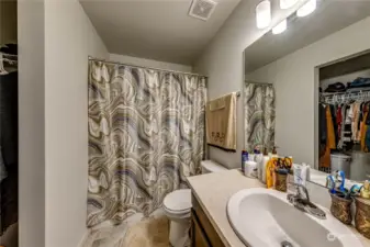 Primary Bath with Tub. You can see the Walk-in Closet in the mirror