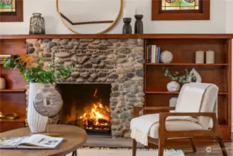 Warm and wonderful stone enhanced wood burning fireplace.