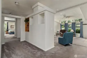 The spacious hall leads to the bedrooms and laundry room.