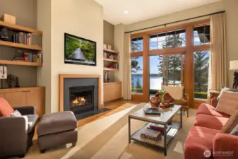 Main floor library with cozy fireplace and fabulous views.