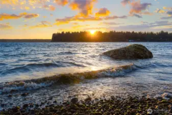 Sunset and lapping waves at your private beach.