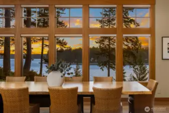 Dining for 14 off of the kitchen and flanked by the fireplace. All day views from the most visited place in the house.
