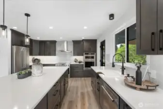 Kitchen Aid Fridge, Dishwasher, Oven Microwave Combo. 36" Thor Freestanding Range. Beautiful backsplash that highlights the cabinets.