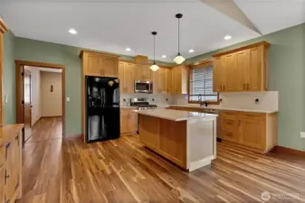 Closer look at the tile backsplash and the plethora of cabinets.
