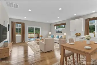 This space has so much possibility! This is just one look you could go for. Canned lighting provides lots of light and options.